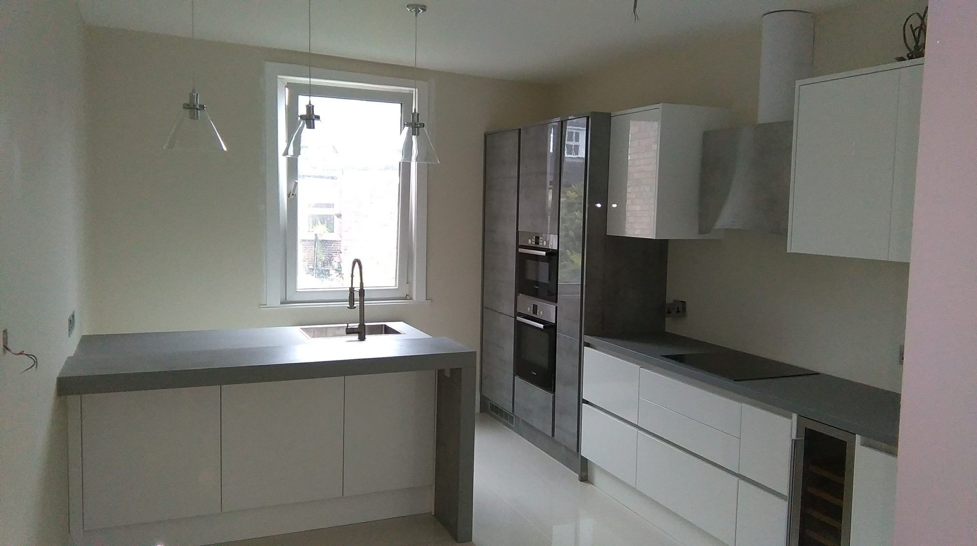 Modern kitchen with peninsula and pendant lights