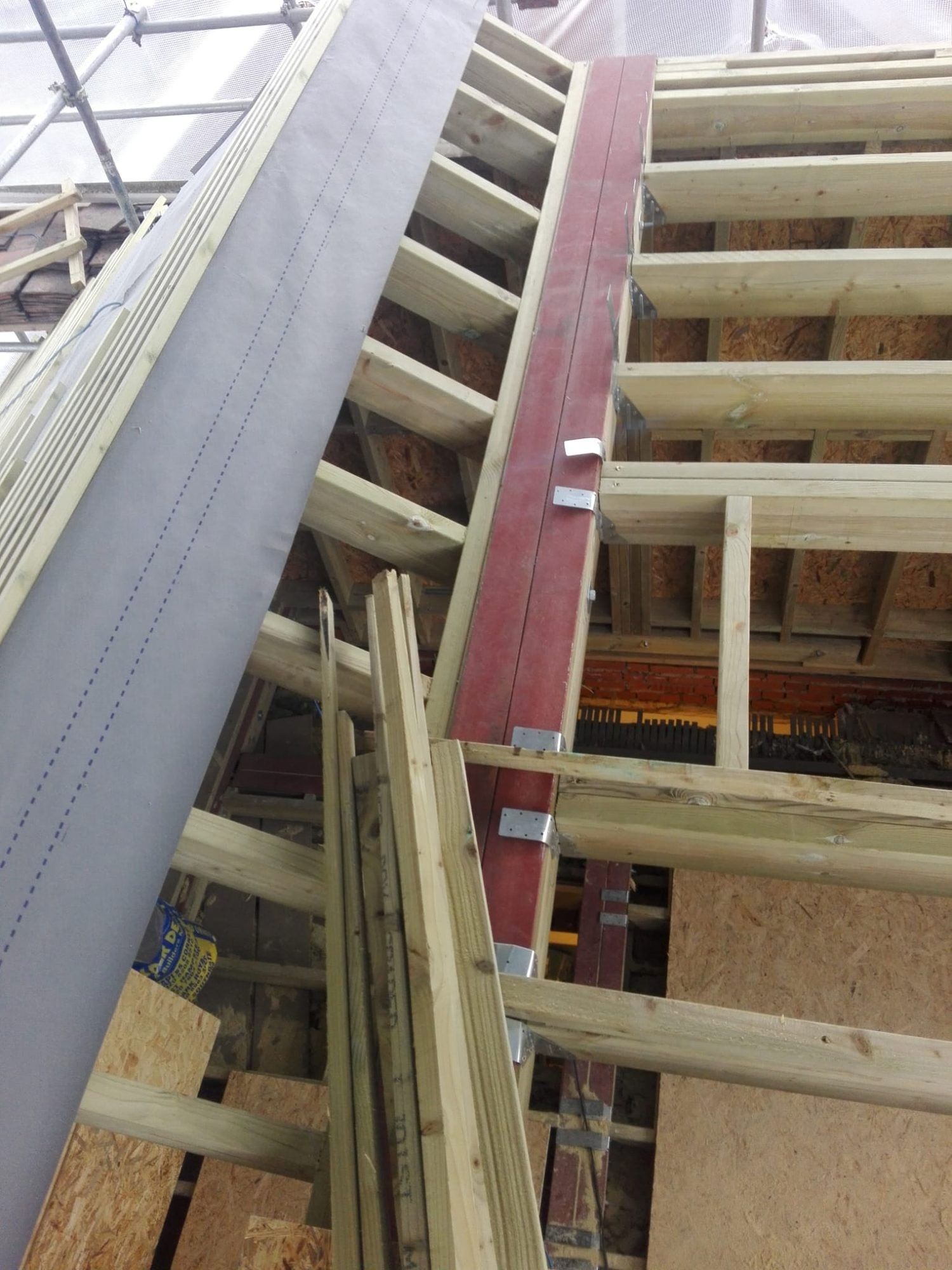 Dormer framing around a new steel beam in a loft